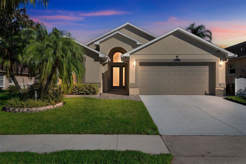 a front view of a house with a yard