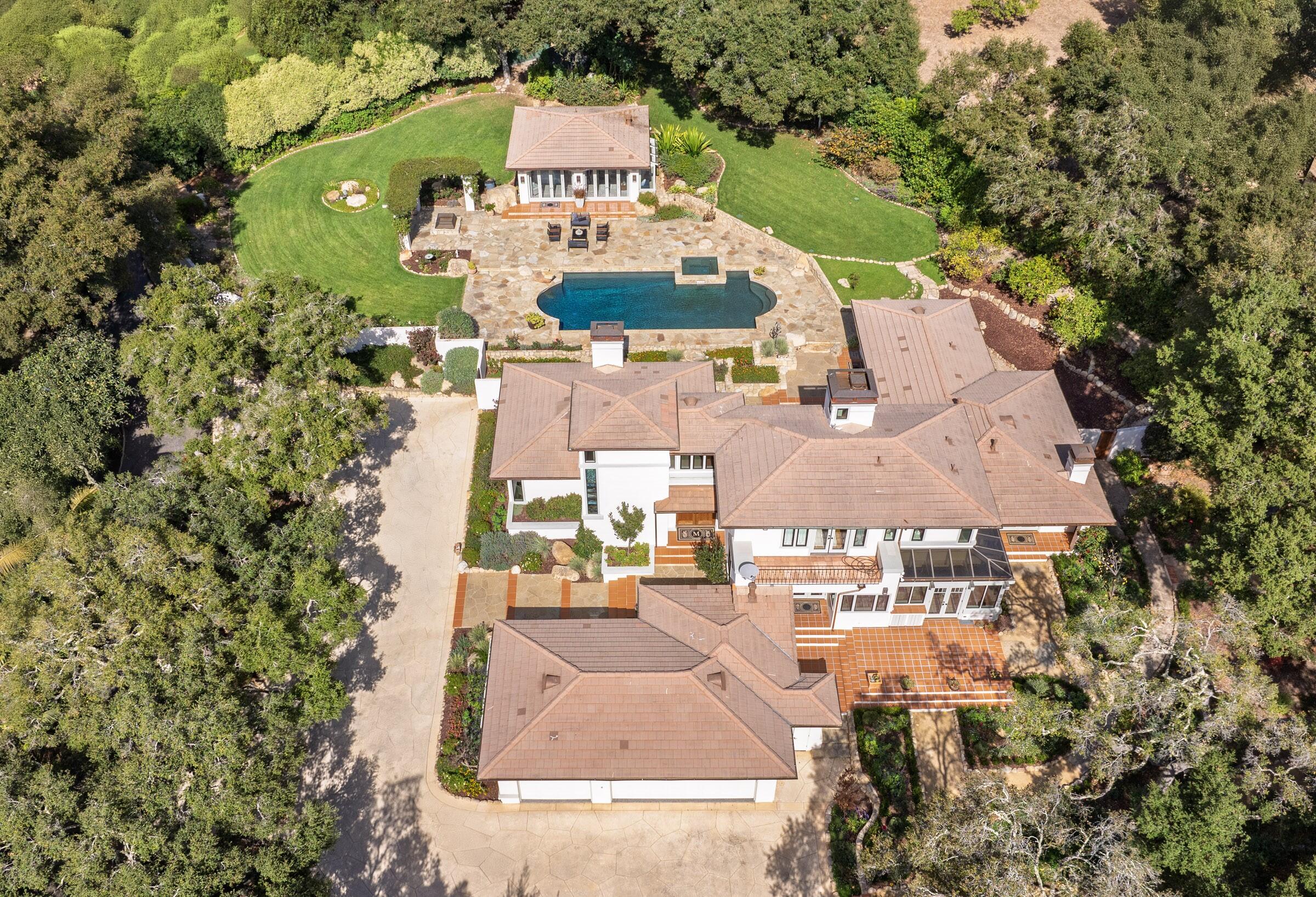 an aerial view of a house with outdoor space