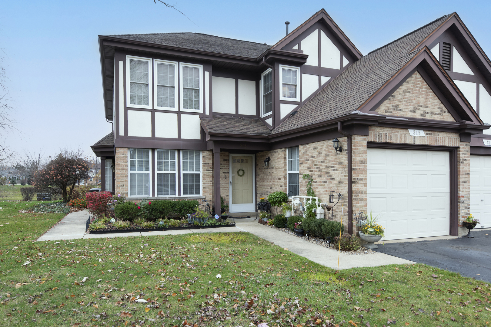 a front view of a house with garden