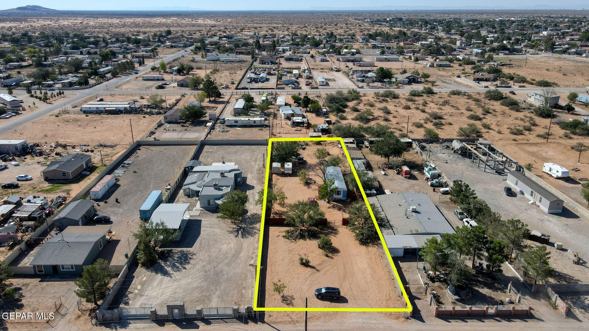 an aerial view of multiple houses with yard