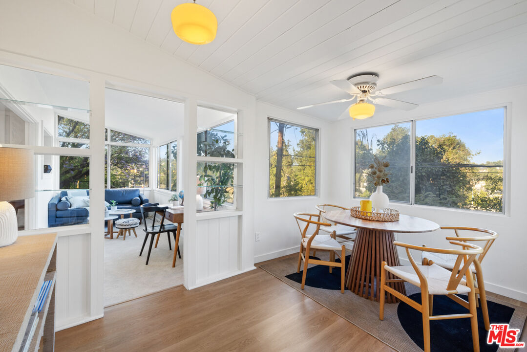 a view of a dining room with furniture and a table