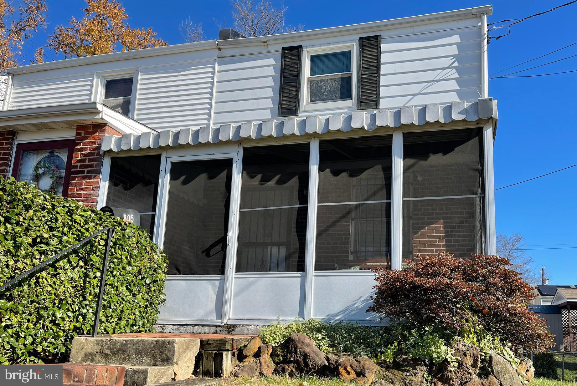 a view of a house with a window and balcony