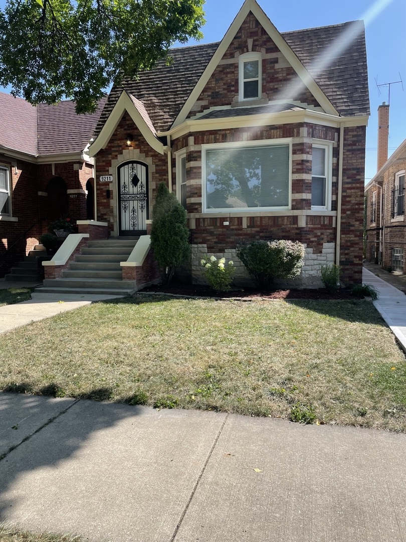 a front view of a house with garden