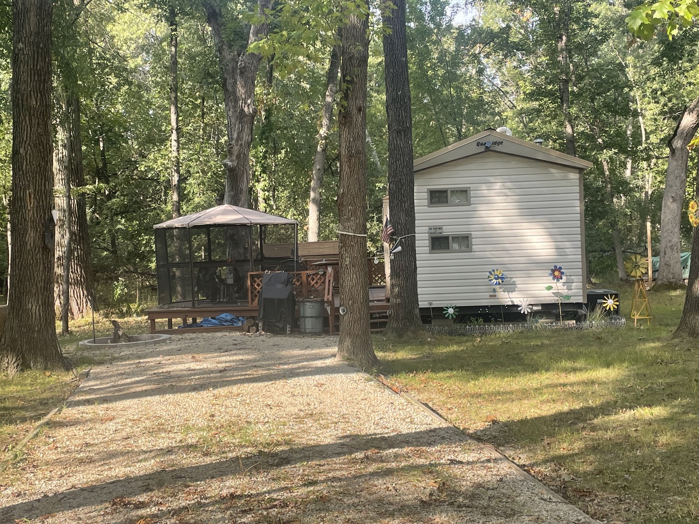 a view of a house with pool and chairs under an umbrella