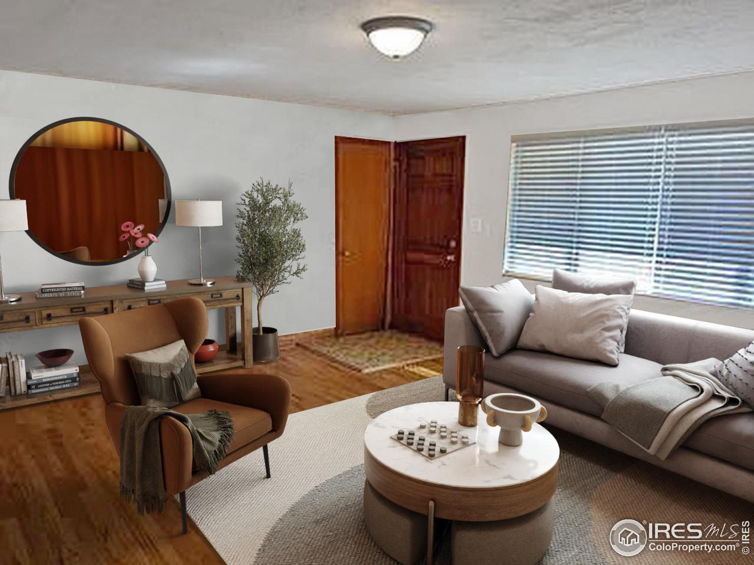 a living room with furniture and a wooden floor