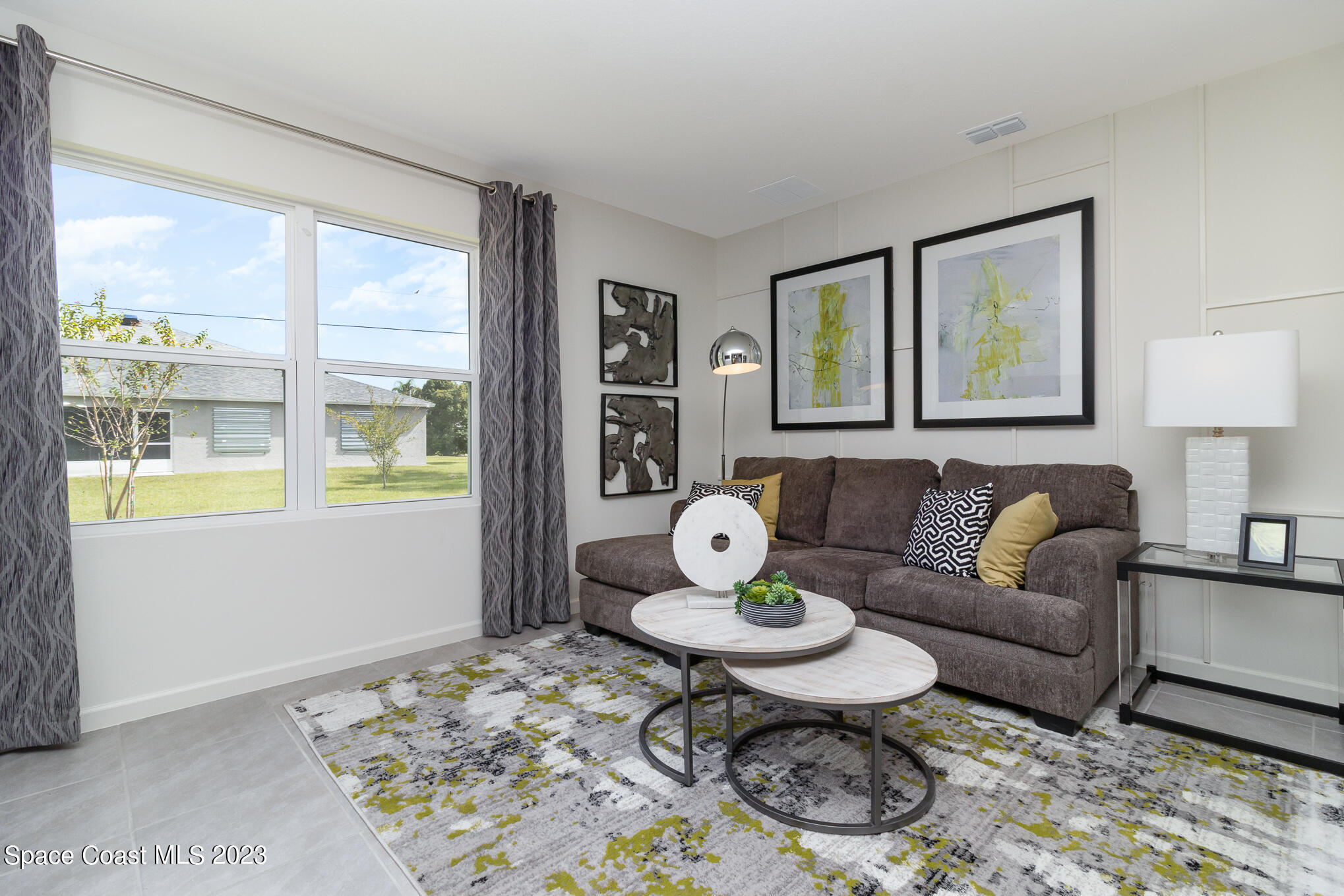 a living room with furniture and a table