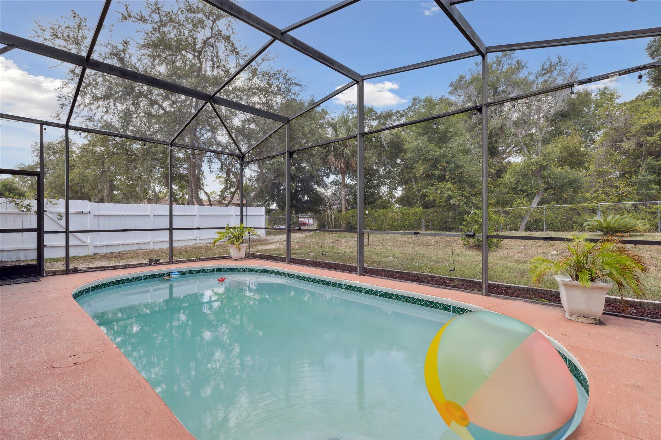 a view of a swimming pool with a backyard