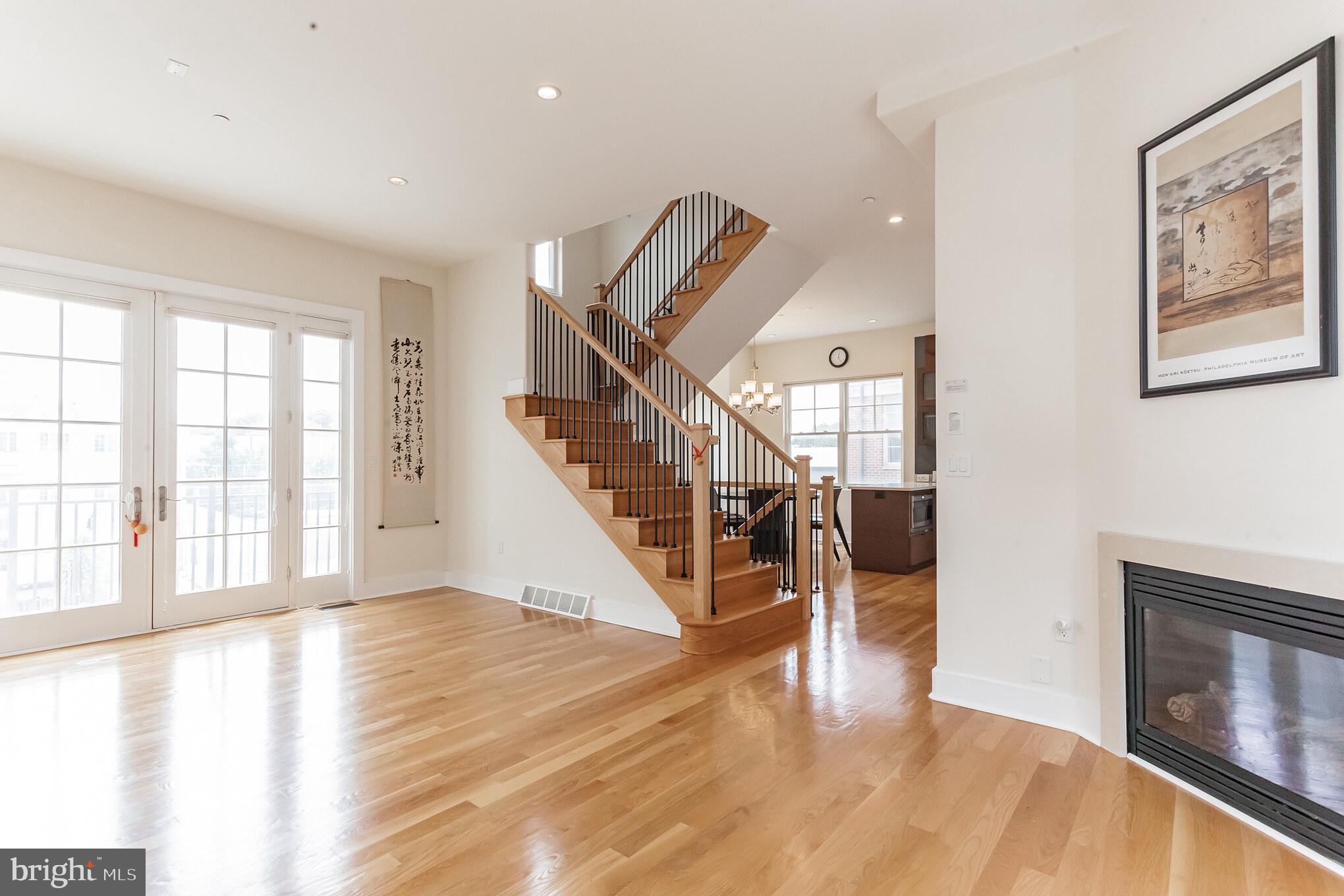 a view of an entryway with wooden floor