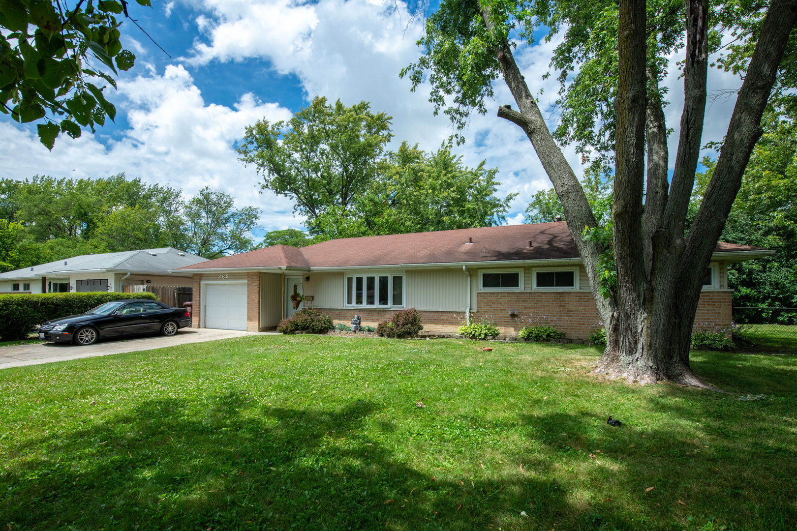 a view of a house with a yard