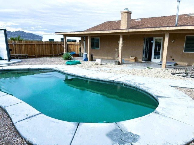 a view of a house with swimming pool