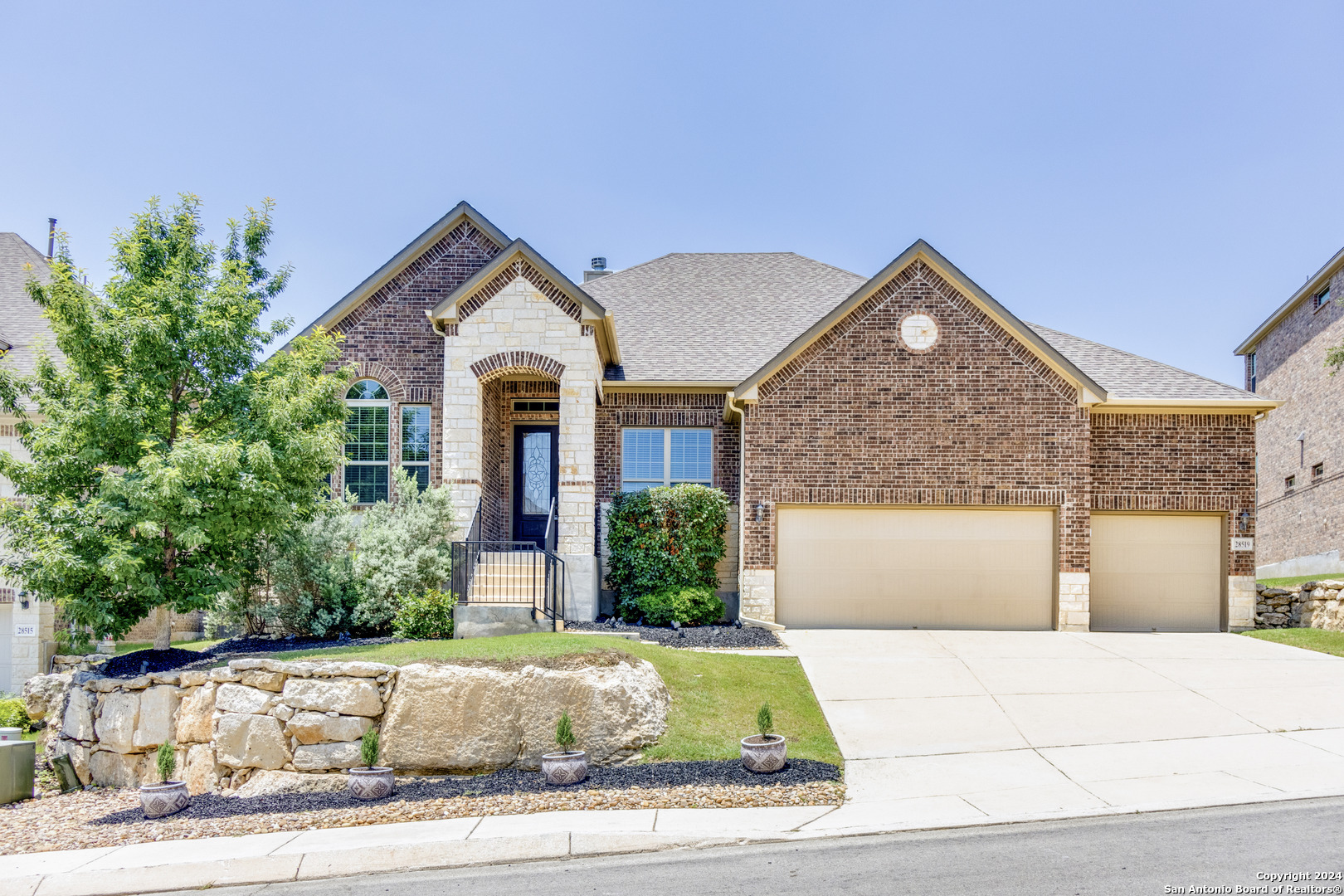 front view of a house with a yard