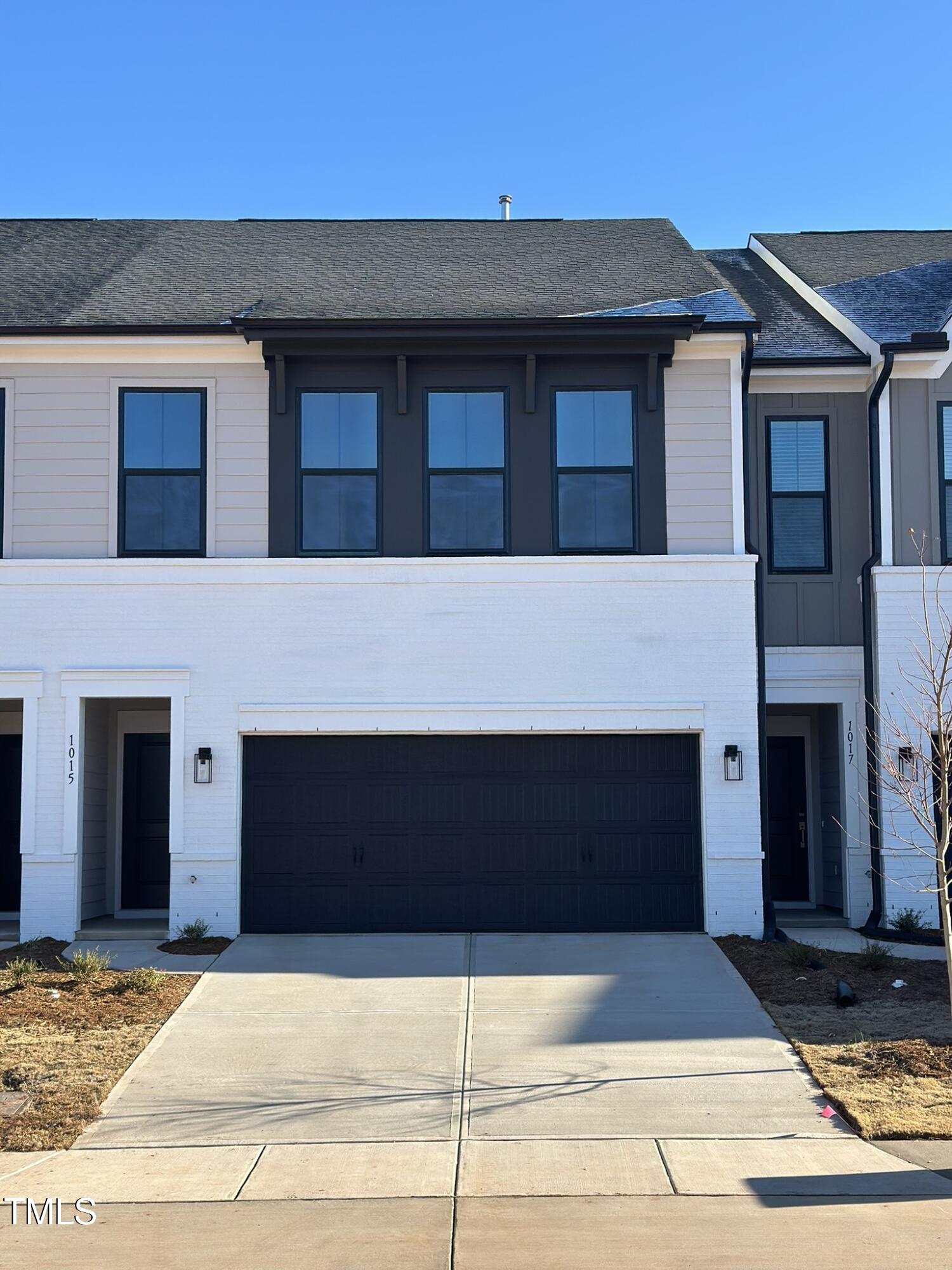 a front view of a house with garage