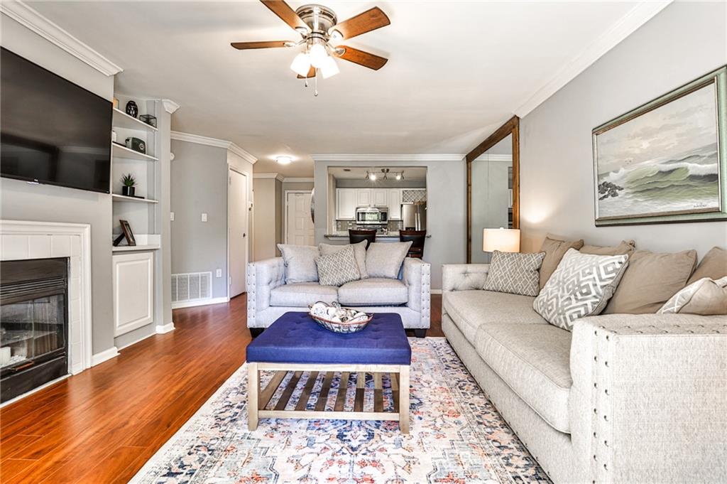 a living room with furniture and a fireplace