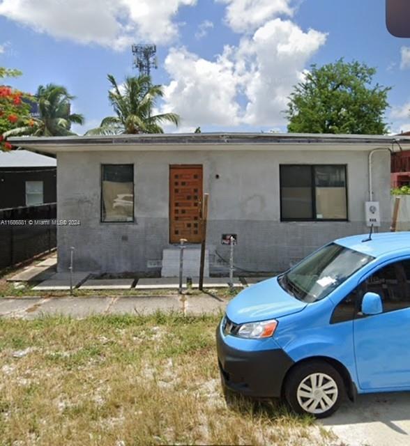 a front view of a house with yard