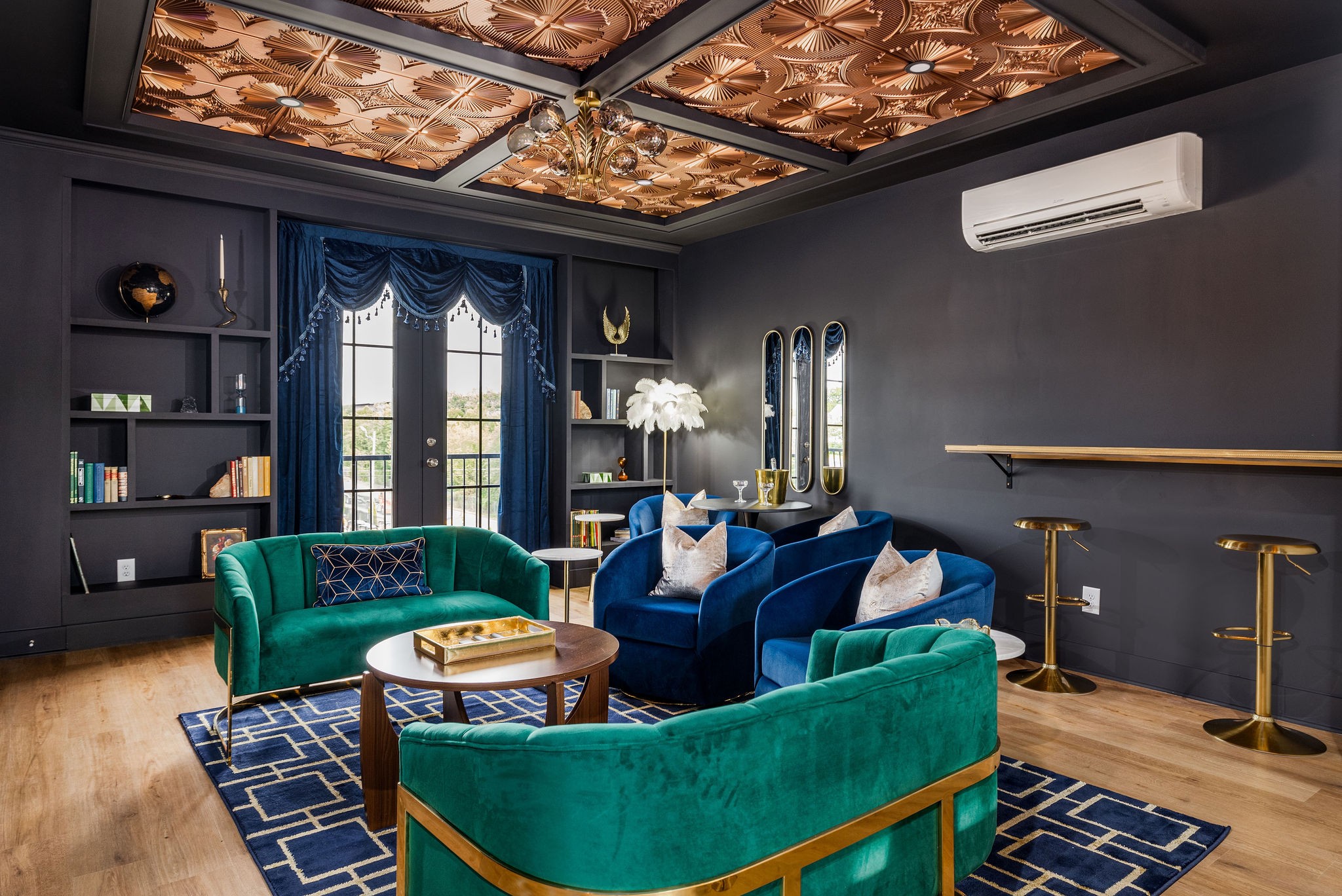 a living room with furniture and a floor to ceiling window