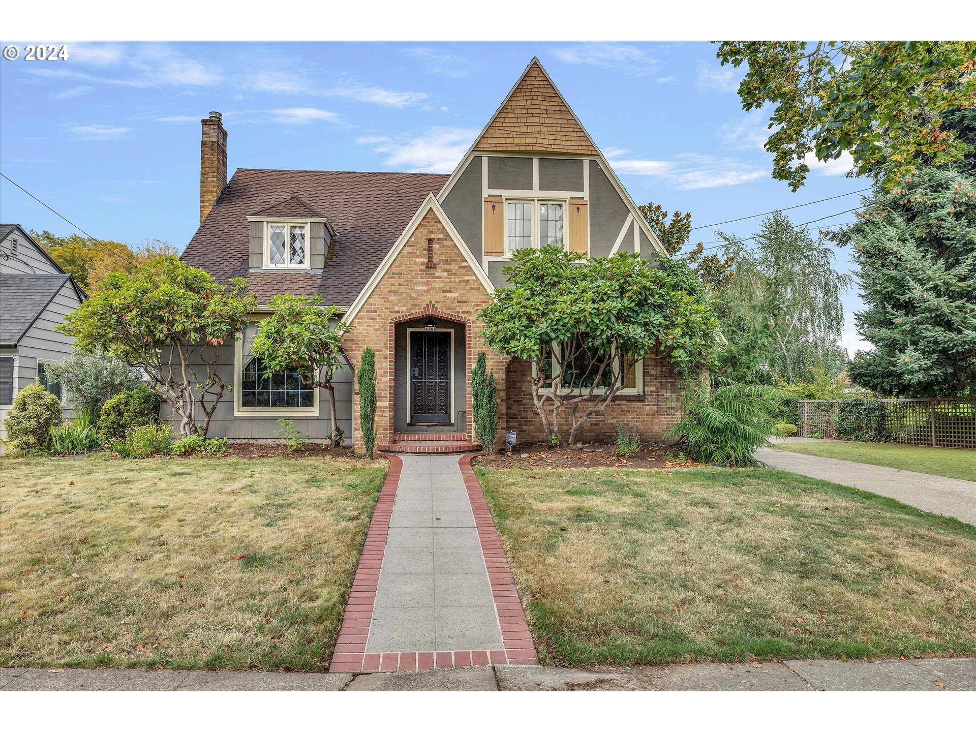 a front view of a house with yard