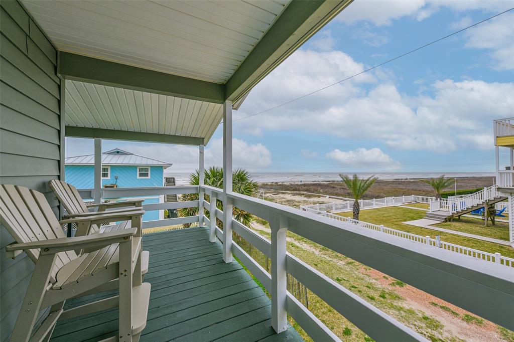 a view of a balcony with chairs