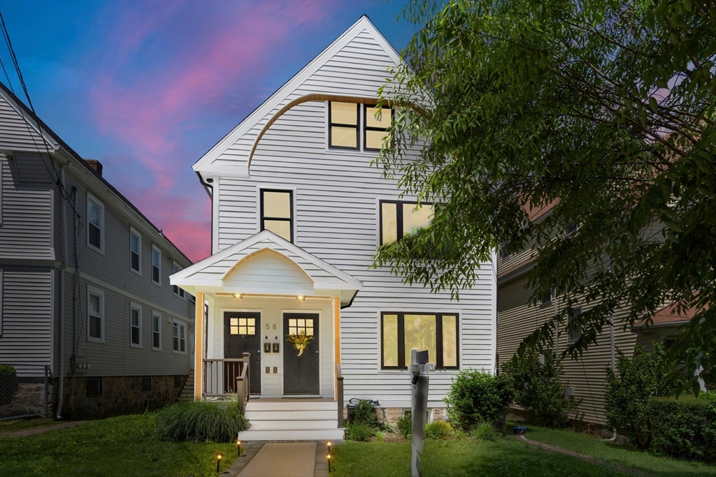 a front view of a house with a yard