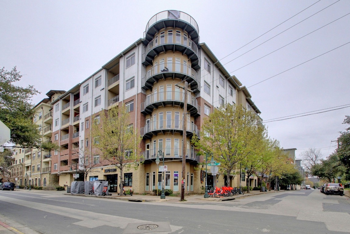 a tall building sitting on the side of a street