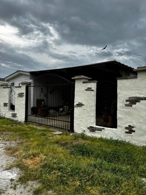 a view of a house with a fence