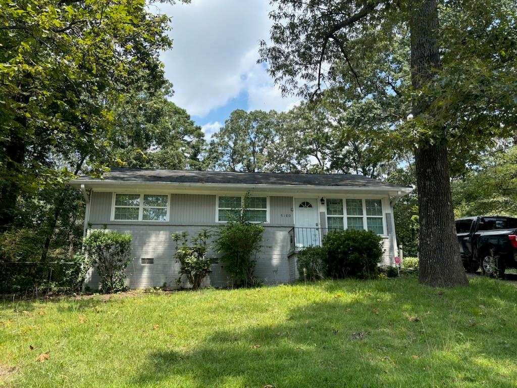 front view of a house with a garden