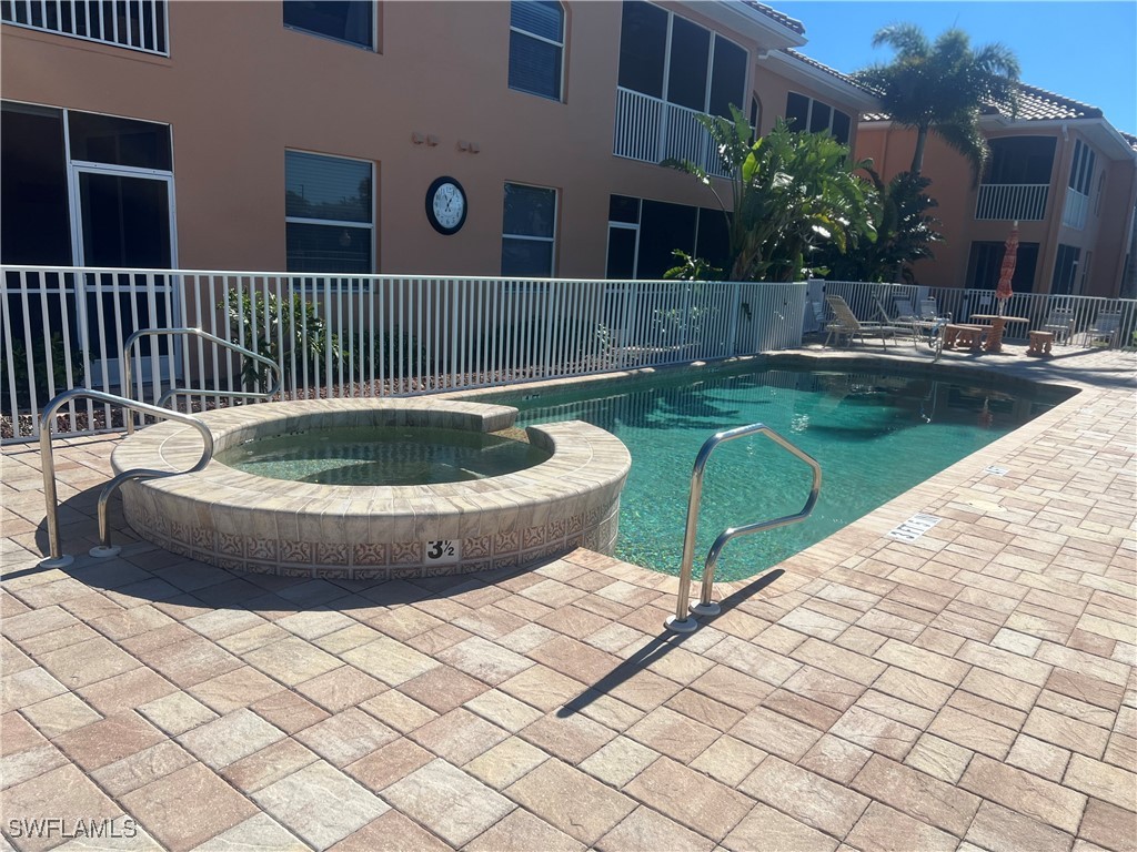 a view of a swimming pool with a house