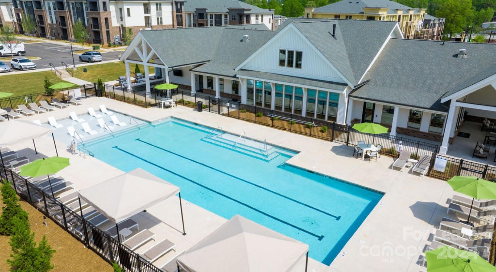 an aerial view of a house with swimming pool