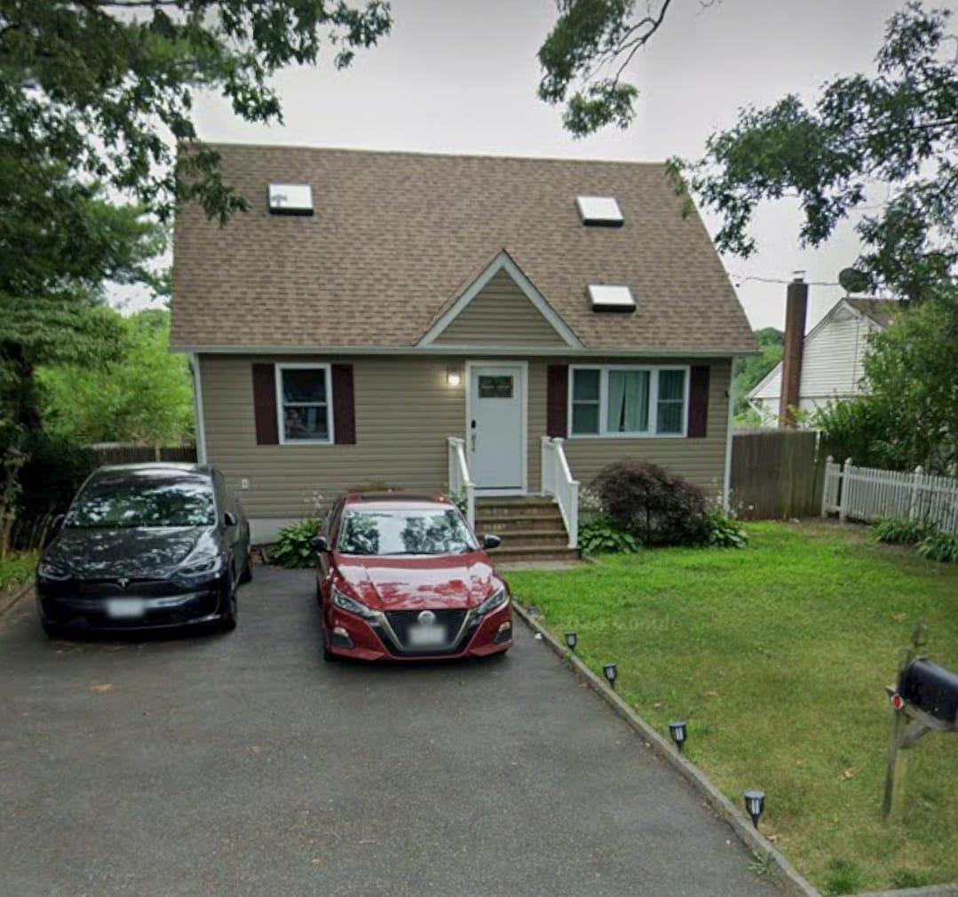 View of front of property with a front yard