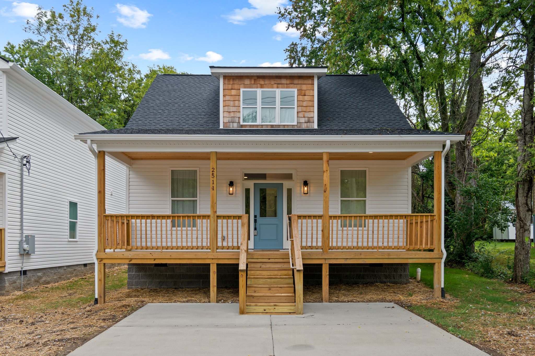 a front view of a house with a porch