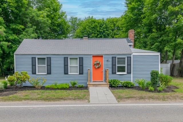 front view of house with a yard