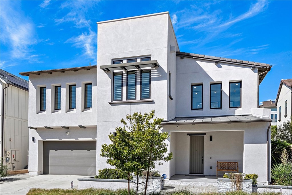 a front view of a house with a garage