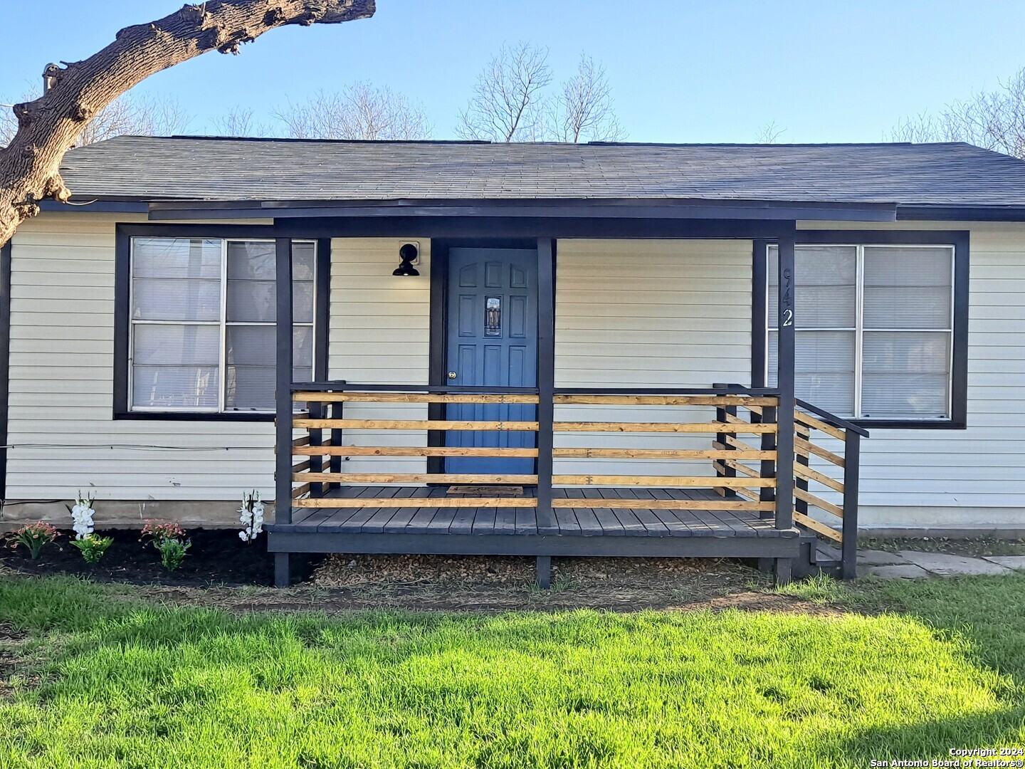 a front view of a house with a yard