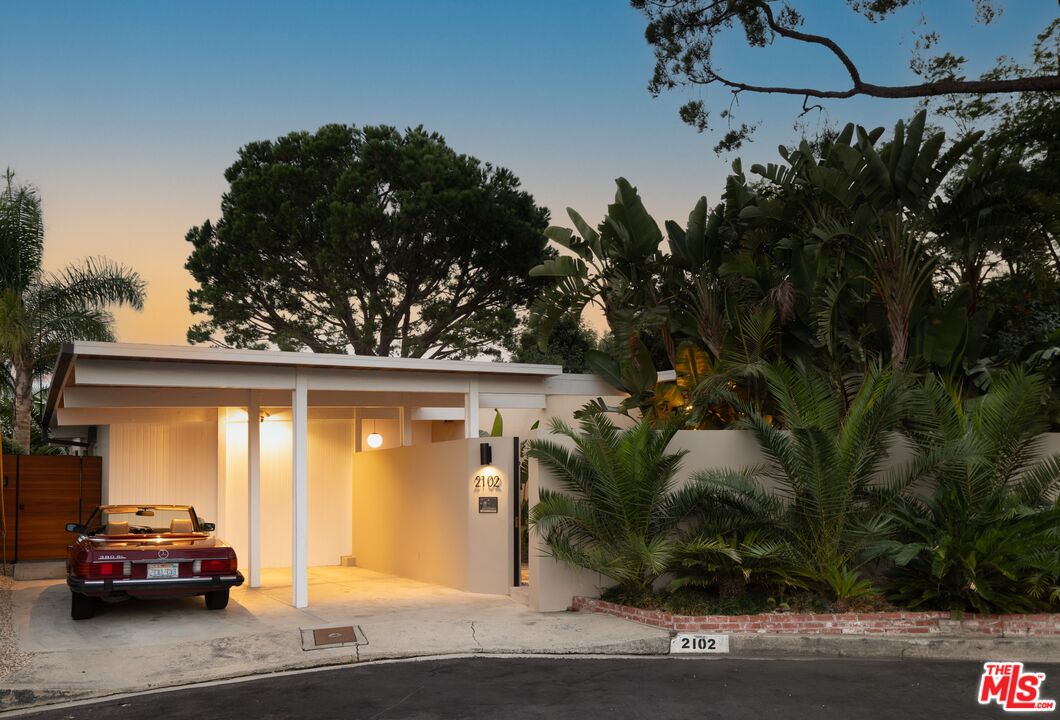 a car parked in front of a house