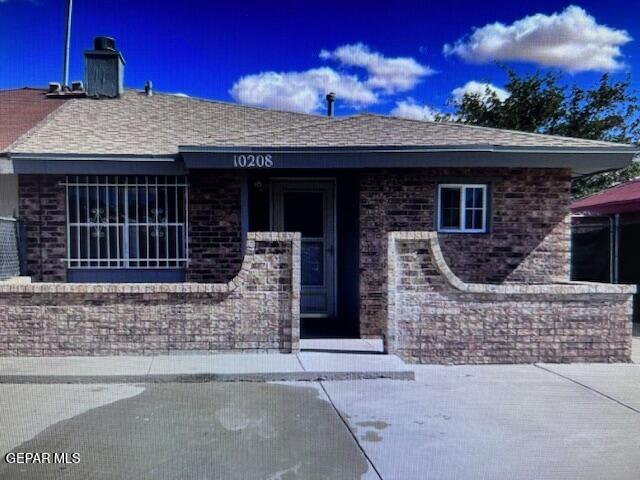 a front view of a house with a garage