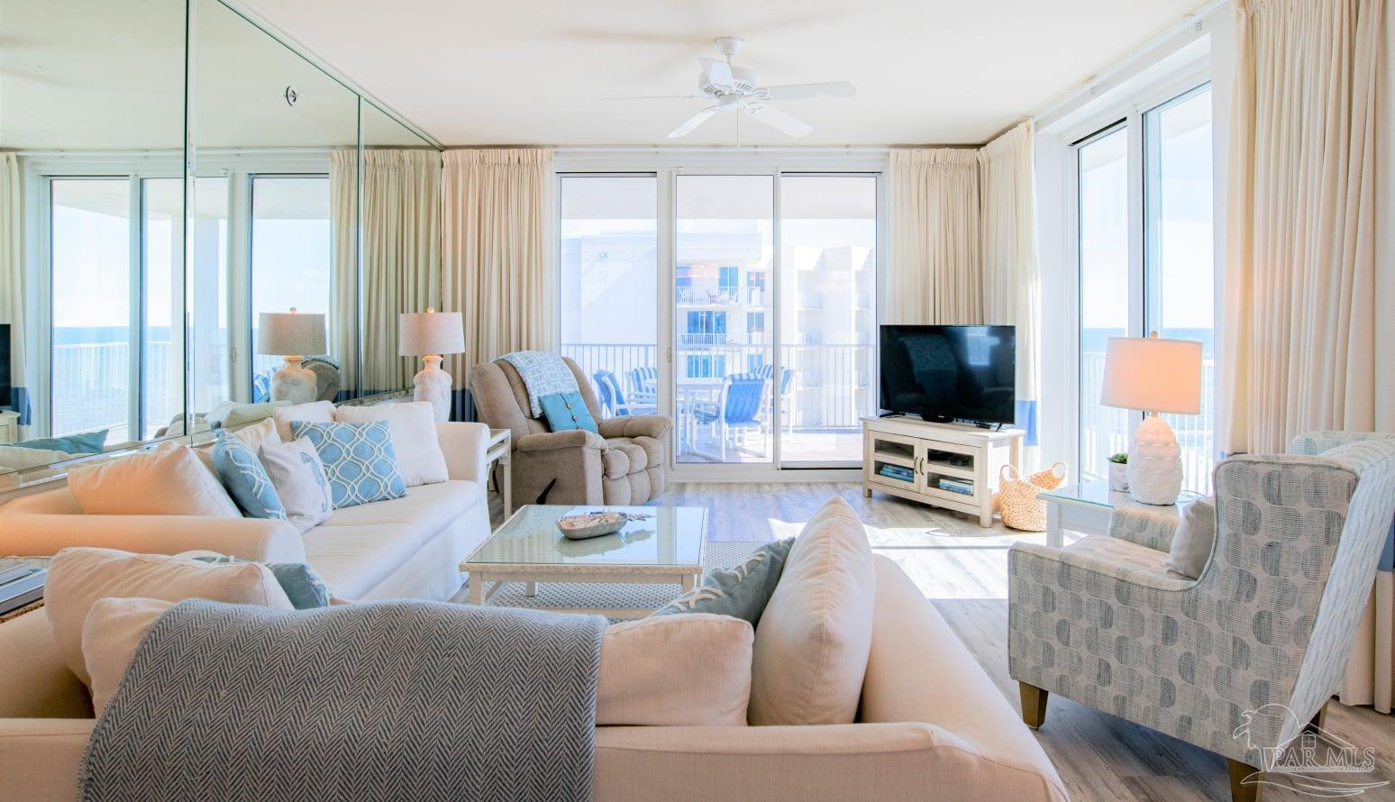 a living room with furniture and a flat screen tv