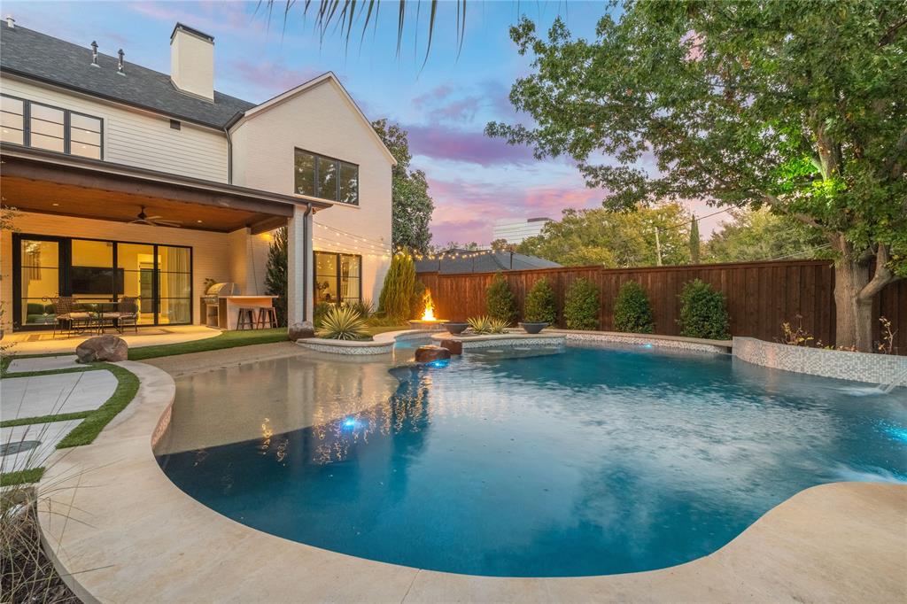 a view of a swimming pool with an outdoor seating