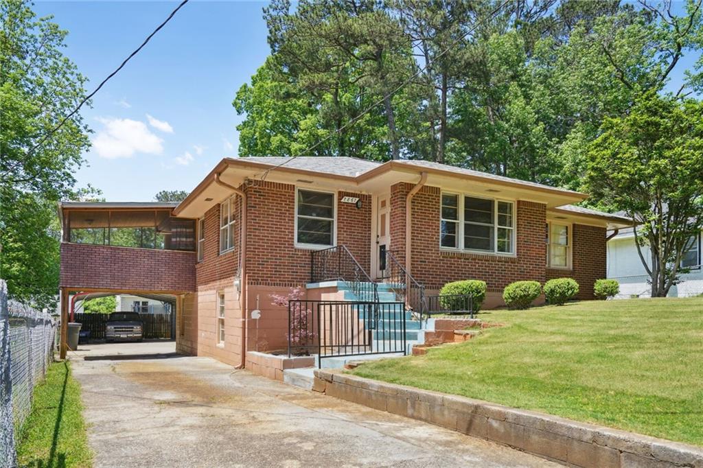 a front view of a house with a yard