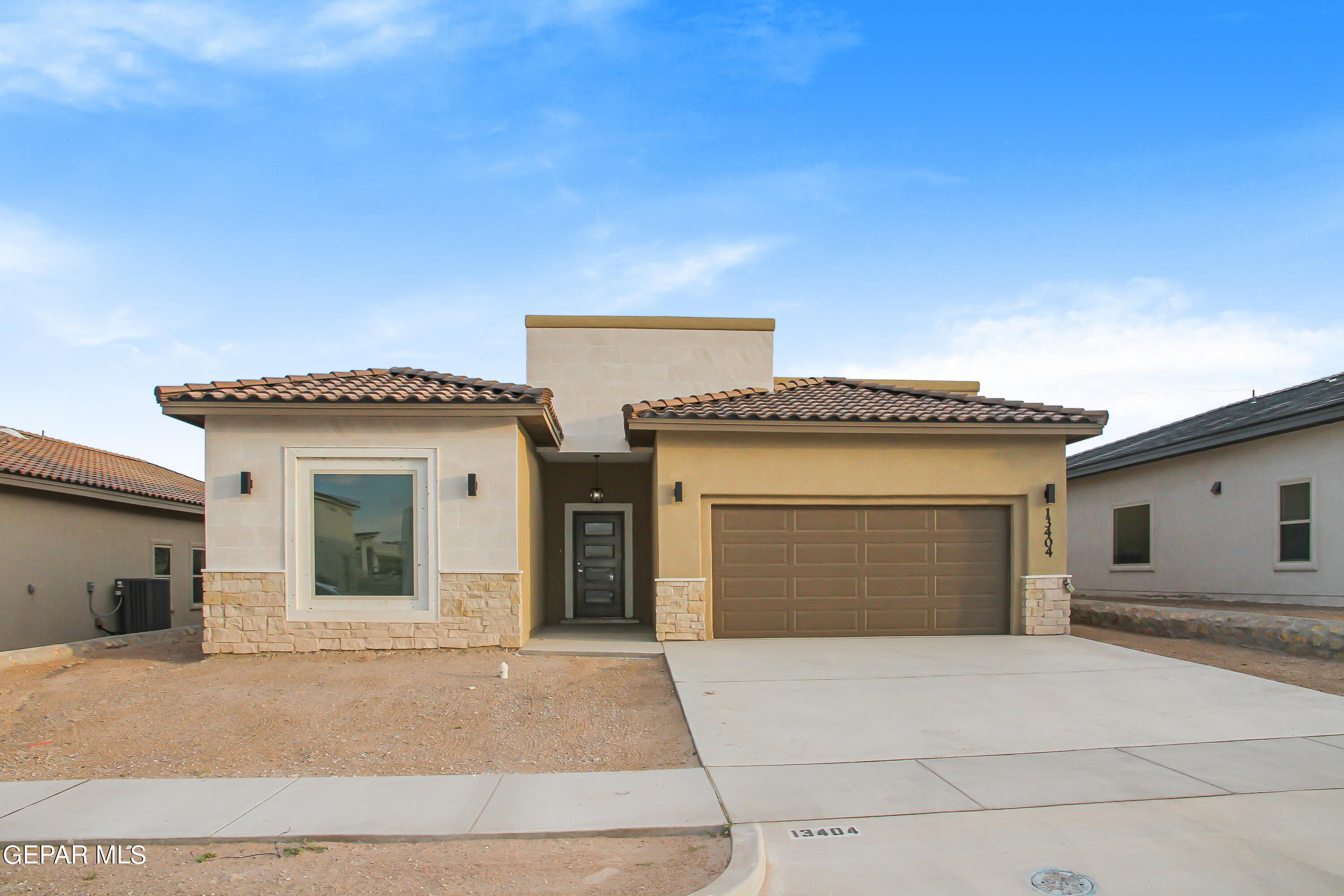 a front view of a house with a garage