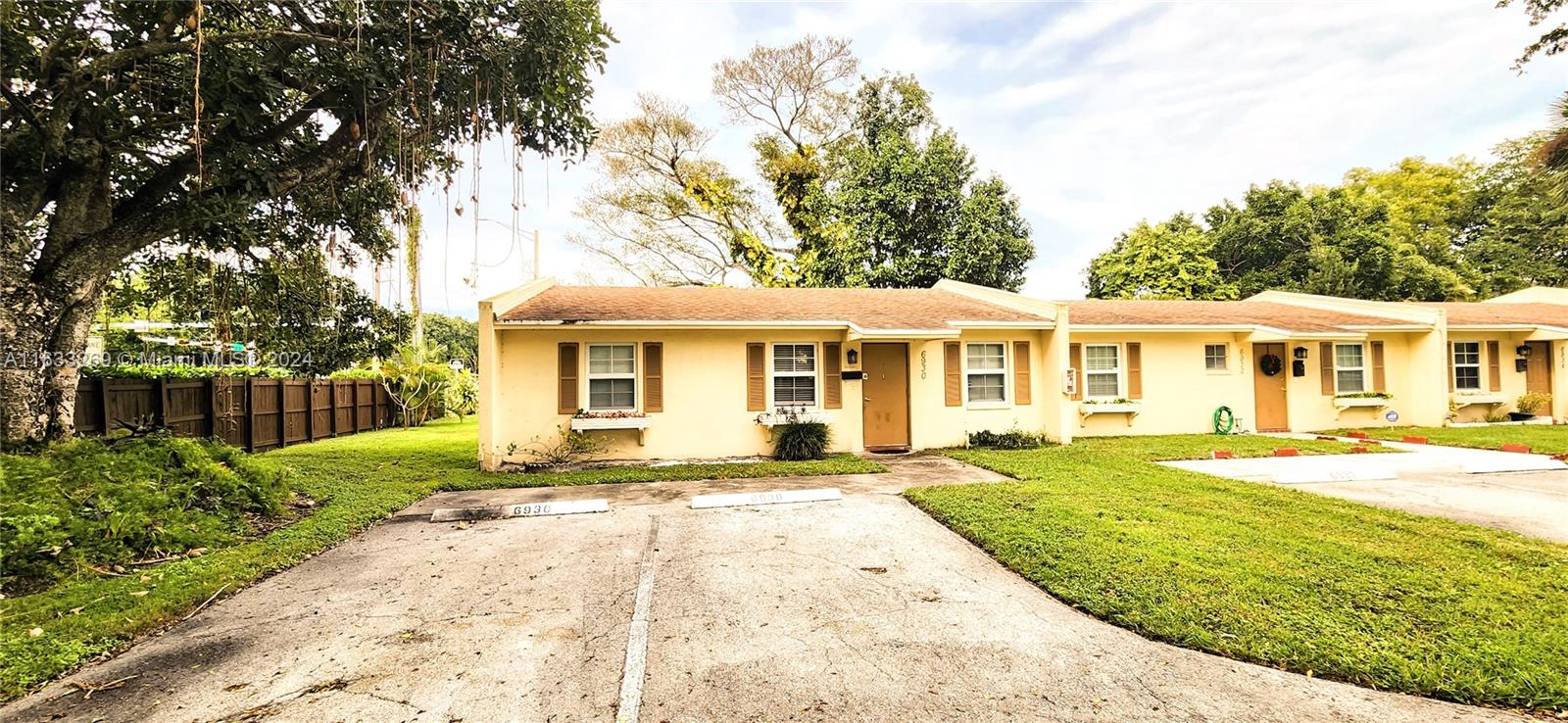 a front view of a house with a yard and porch