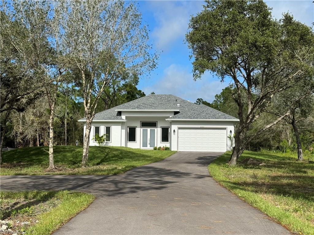 front view of a house with a yard