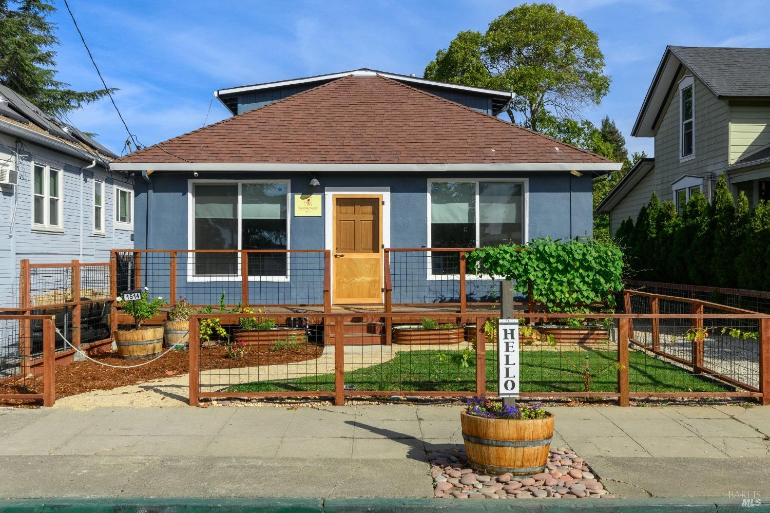 a front view of a house with garden