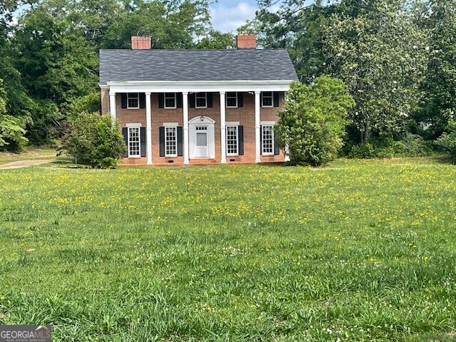 front view of a house with a yard