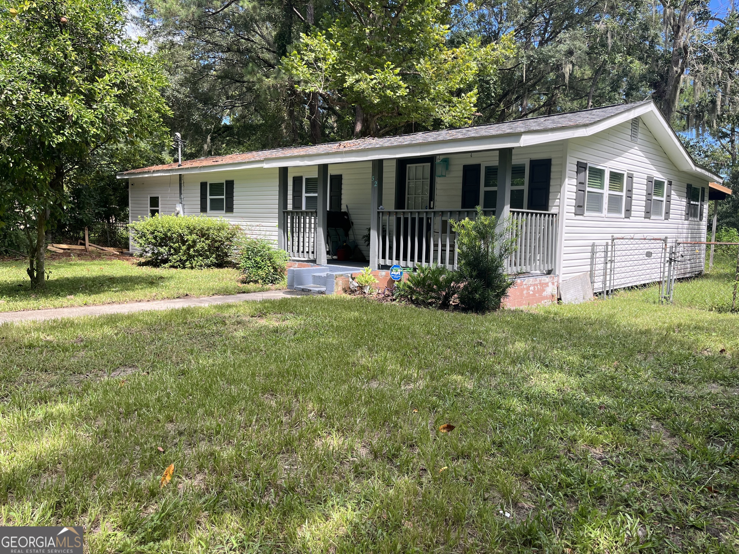 front view of a house with a yard