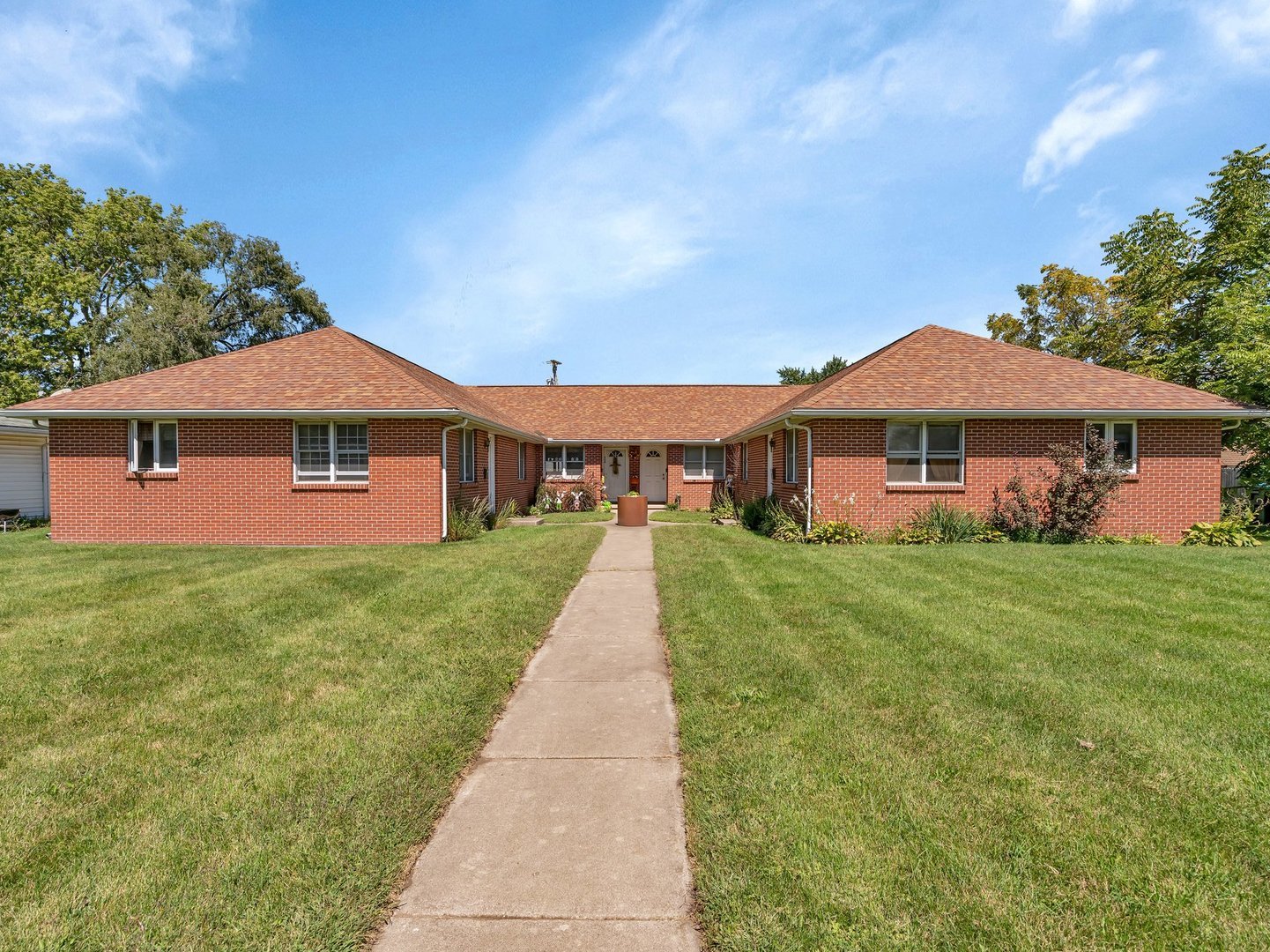 a front view of a house with yard