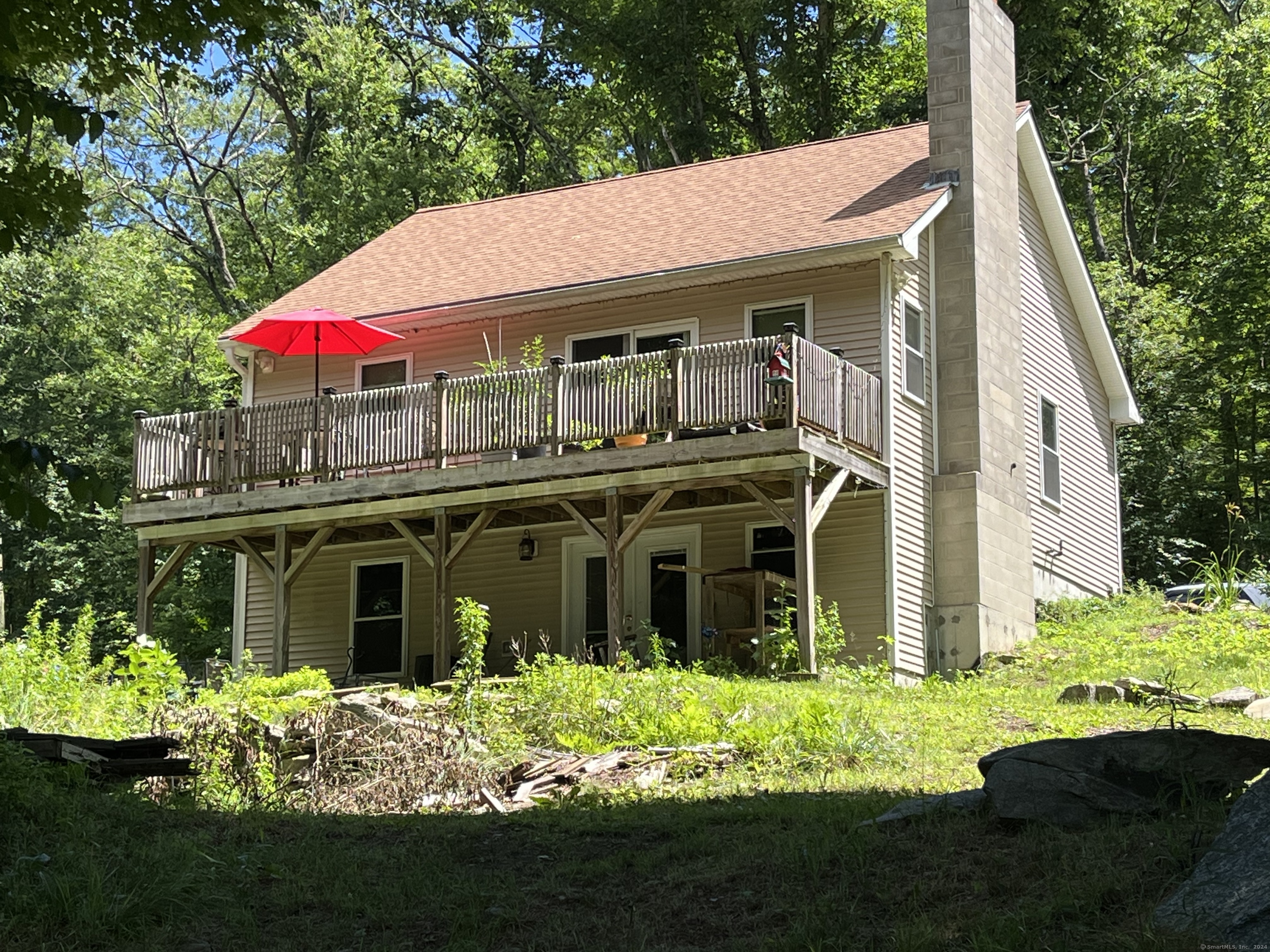 a view of a house with garden and yard