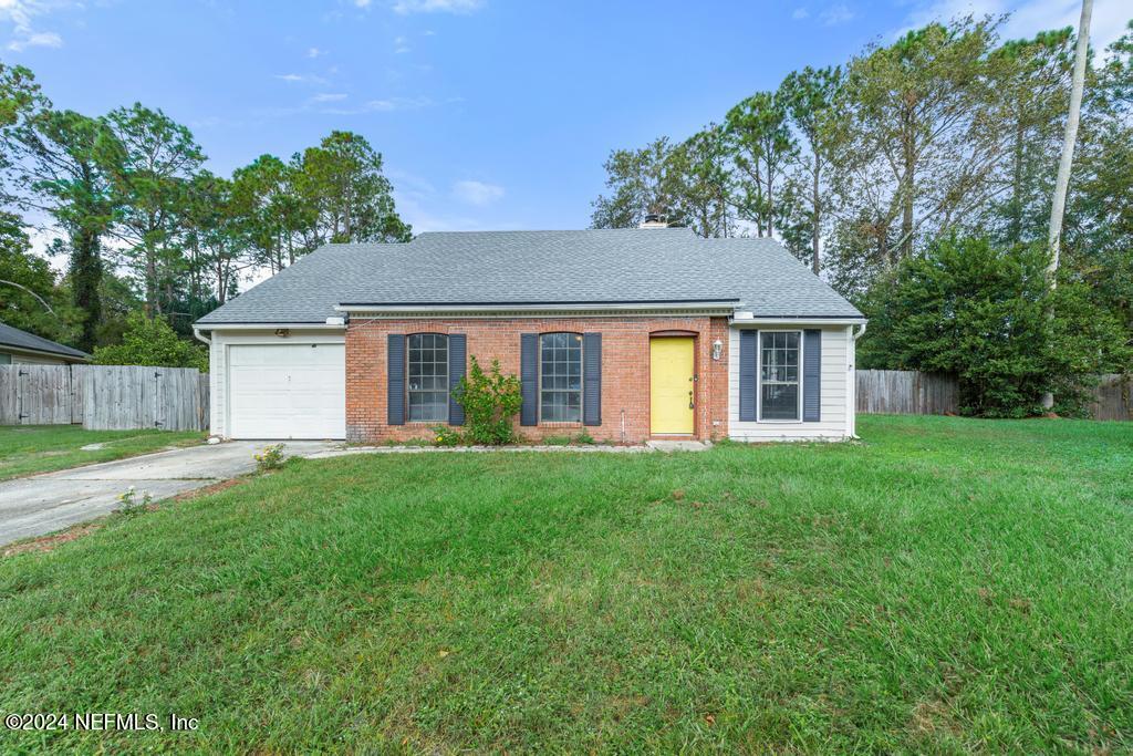 front view of a house and a yard