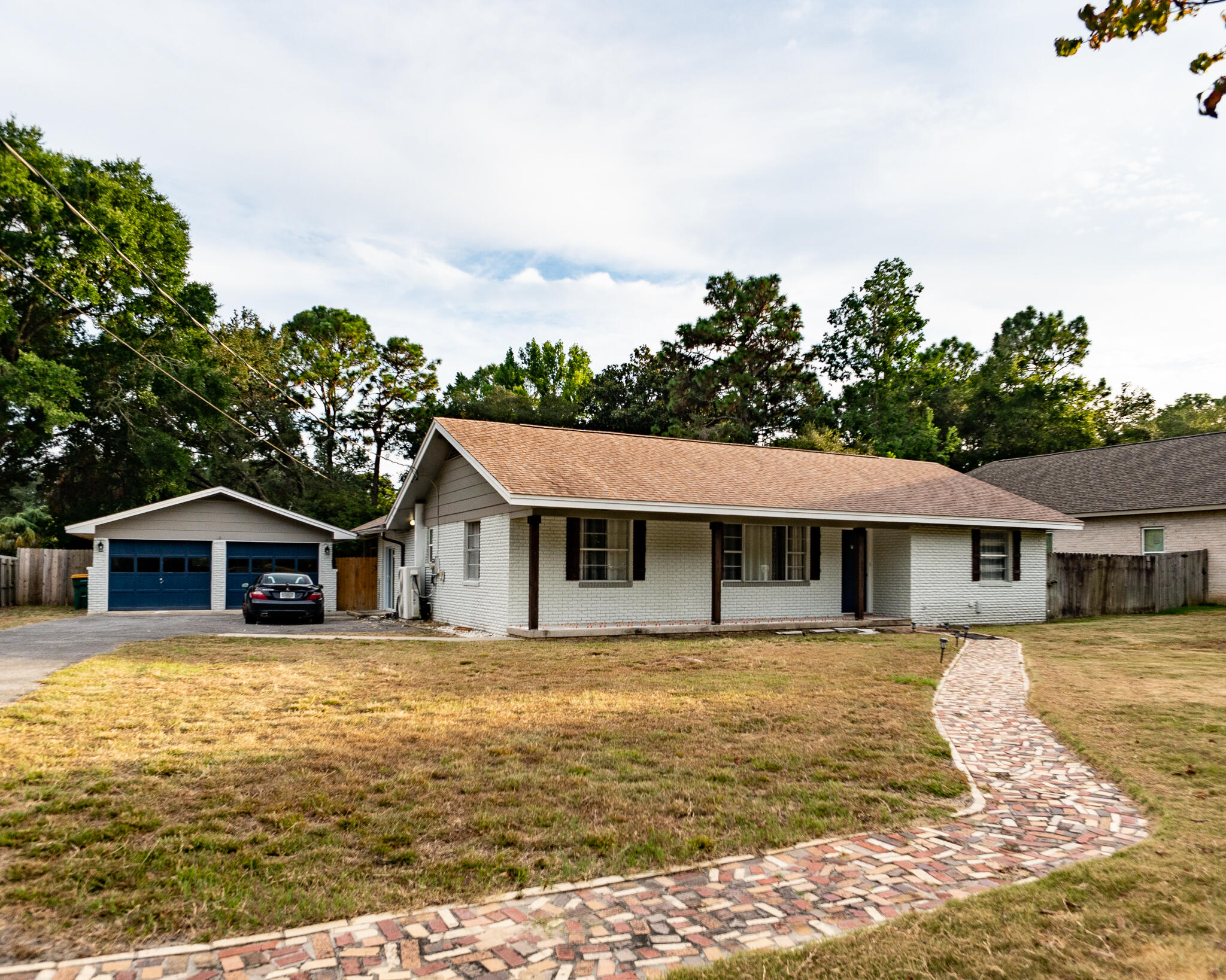 a front view of a house with a yard table and chairs