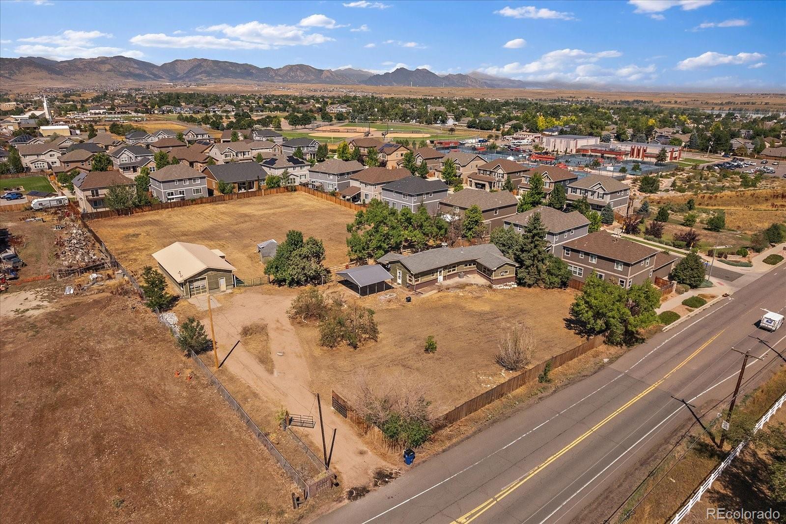 an aerial view of residential houses with outdoor space