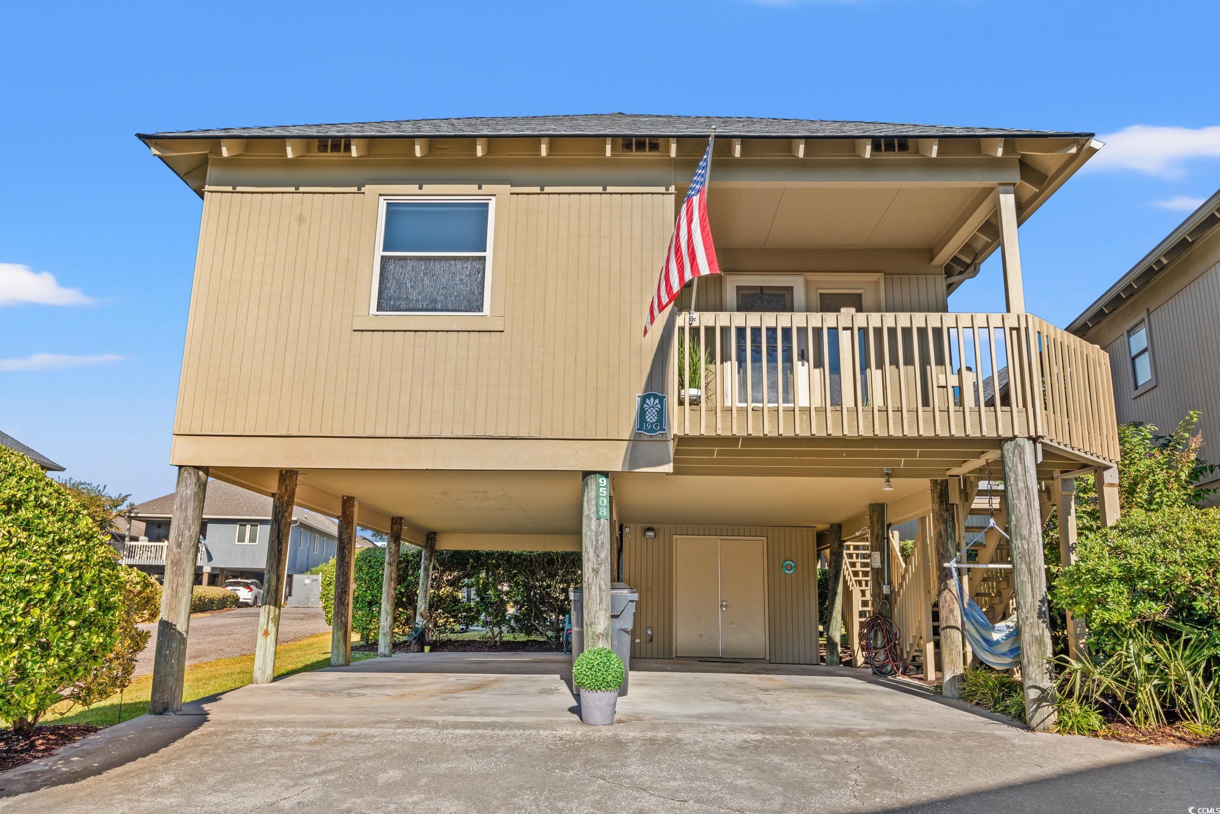 View of front facade featuring a carport