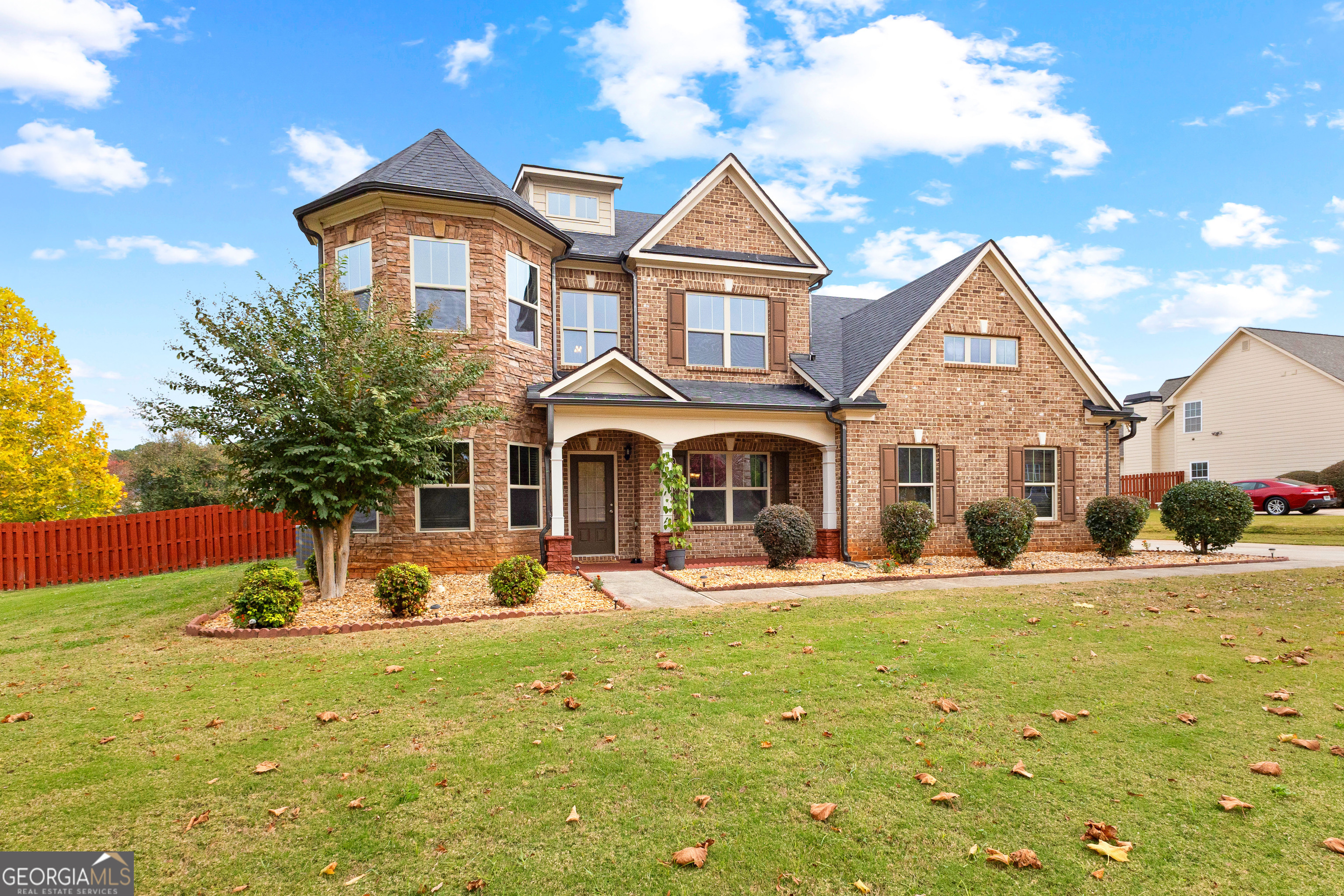 a front view of a house with a yard